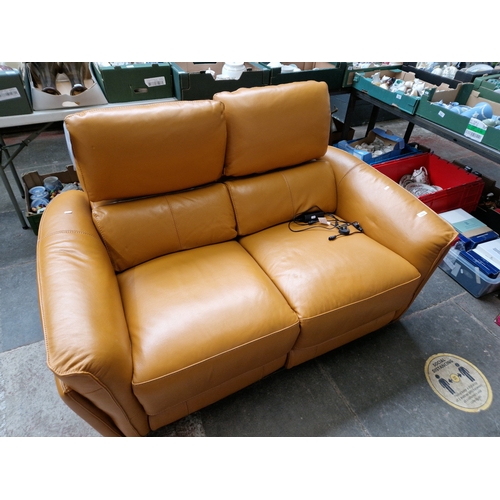 1024 - A modern leather reclining 2 seater sofa