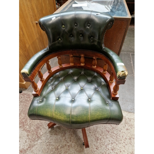 1025 - A green leather captains chair