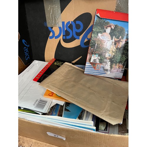 27 - A box containing unused post cards from around the world and video photo discs