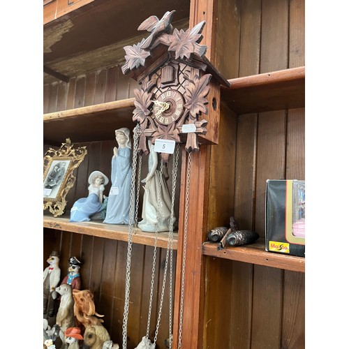 5 - A cuckoo clock with weights