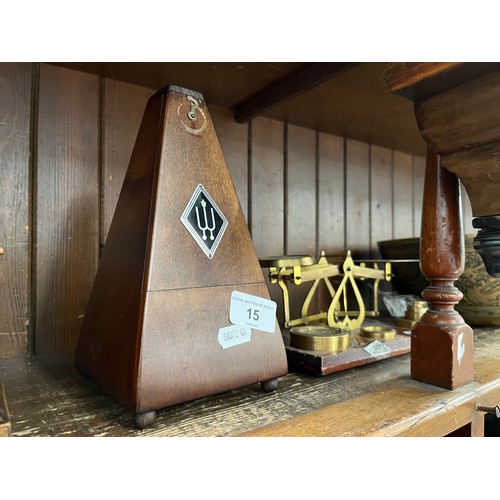 15 - A metronome and a post office style weighing scale with weights