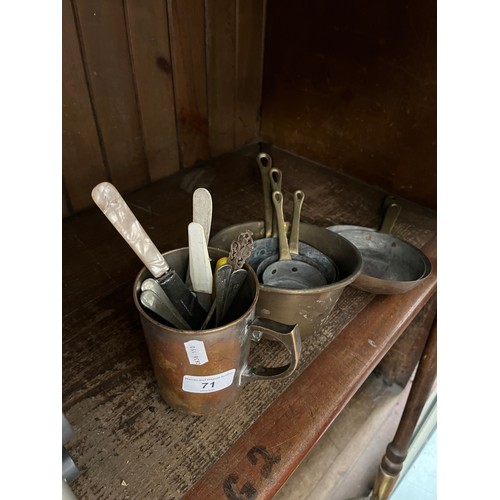 71 - A Victorian brass warming pan, a set of graduated brass and copper pots and a brass mug.