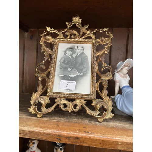 7 - A gilt metal photo frame 20cm x 28cm.