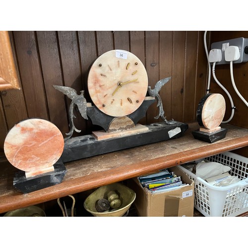 36 - A marble clock with garniture