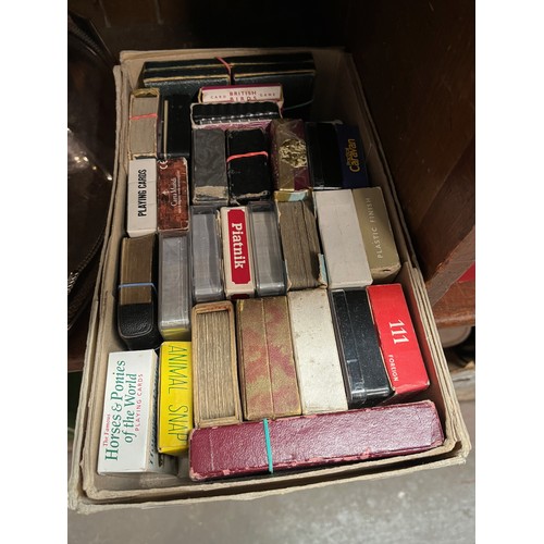 58 - A box containing a collection of vintage playing cards.