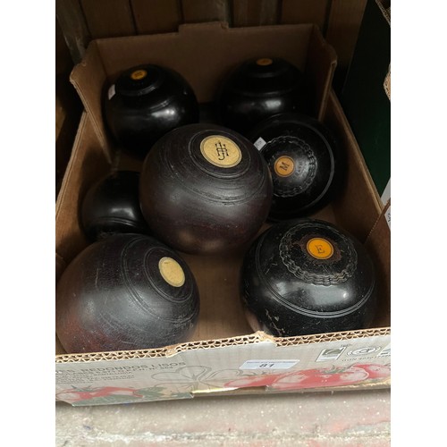 81 - A box containing 3 sets of crown green bowls and 2 jacks