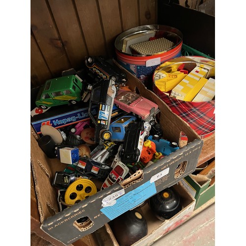 63 - A box of toy vehicles including Corgi, Dinky, along with 2 tins of Lego