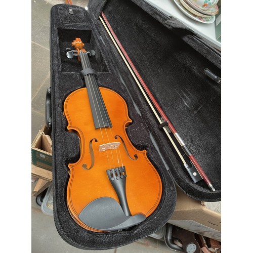 75 - A student violin with bow, in case.