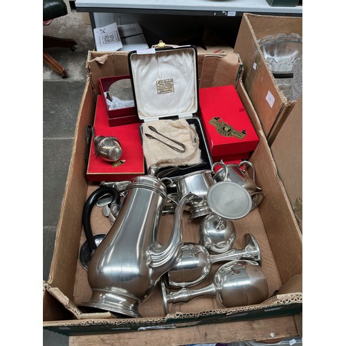 105 - A box of miscellaneous metals including a hallmarked silver small knife with sugar tongs and cut gla... 