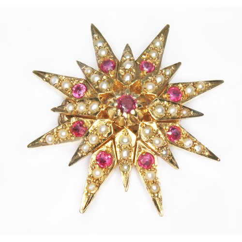 78 - A ruby and split pearl star shaped separator, hallmarked 9ct gold, sponsor 'HJB', London 1977, diam.... 