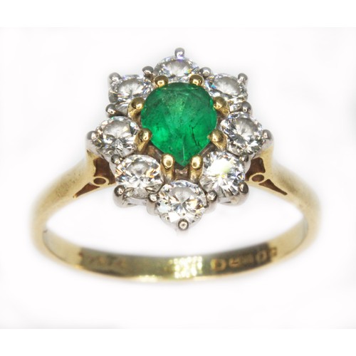 72 - An emerald and diamond cluster ring, the central pear cut stone weighing approx. 0.50cts, surround b... 