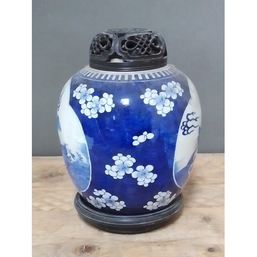 314 - A Chinese blue and white porcelain ginger jar with carved hardwood cover and stand, unmarked, 18th/1... 