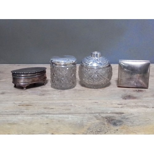 266 - Hallmarked silver comprising a trinket box, a cigarette box and two silver topped jar/bottle.