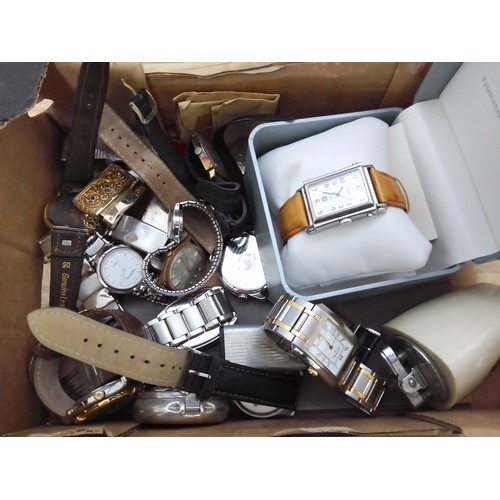 300 - A box of assorted watches including a Rotary Elite tank style watch etc.