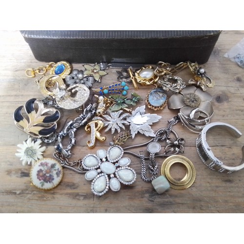 296 - A box of assorted vintage and later costume jewellery.