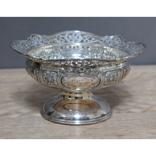 155 - An Edwardian silver pedestal dish, pierced rim above bowl with embossed panels, domed foot, John Rod... 