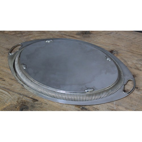 160 - An Edwardian silver tray, oval form with twin handles, gadrooned border and engraved floral decorati... 