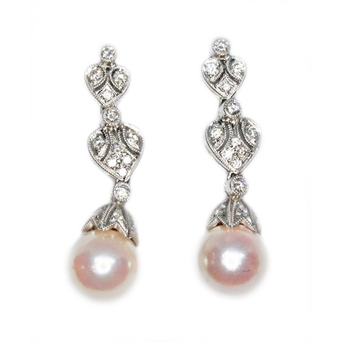 82 - A pair of South Sea cultured pearl and diamond drop earrings, the pearls approx. 8mm in diameter, le... 