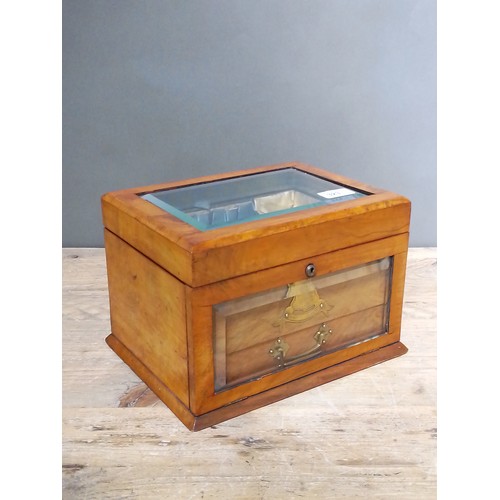 323 - A late 19th century walnut jewellery box, bevelled glass top, opening to reveal padded well, bevelle... 