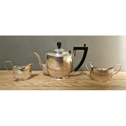 349 - A matched hallmarked silver tea set comprising teapot, sugar bowl and milk jug, various maker's mark... 