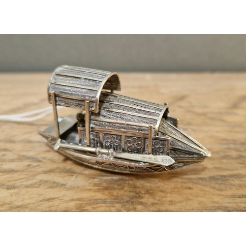 352 - A novelty Chinese silver model of a boat, gross wt. 21.6 g.