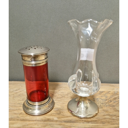 355 - A cranberry glass sugar sifter with silver top and base together with a bud glass vase with silver b... 