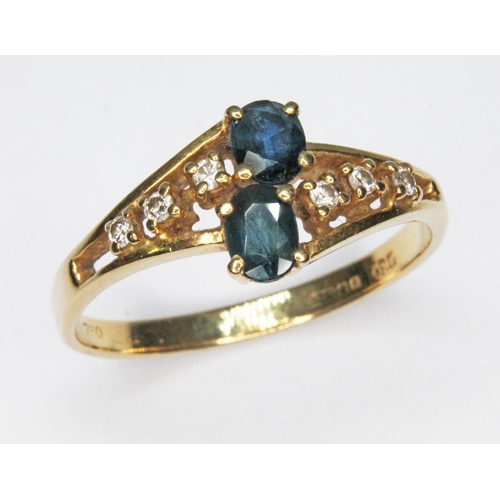 374 - A diamond and sapphire cluster ring, 18ct gold import marks, gross wt. 2.9g, size Q.