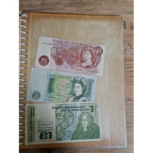 243 - Three folders of assorted world banknotes