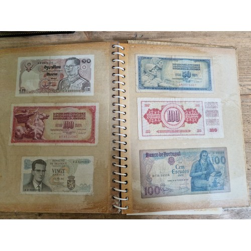 243 - Three folders of assorted world banknotes