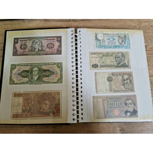 243 - Three folders of assorted world banknotes