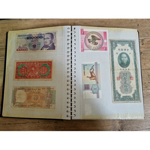 243 - Three folders of assorted world banknotes