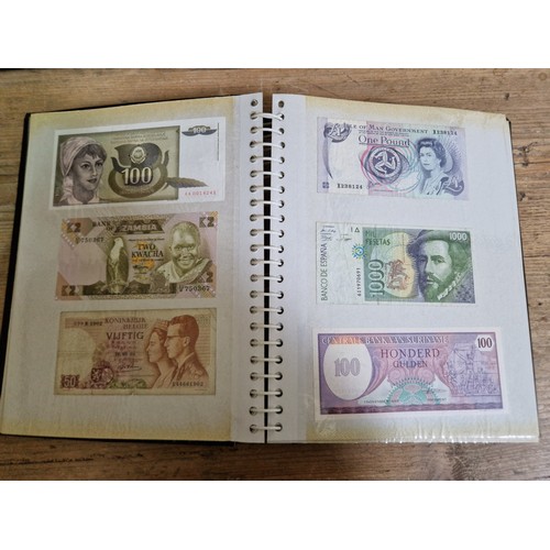 243 - Three folders of assorted world banknotes