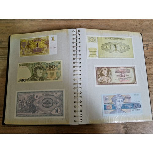 243 - Three folders of assorted world banknotes