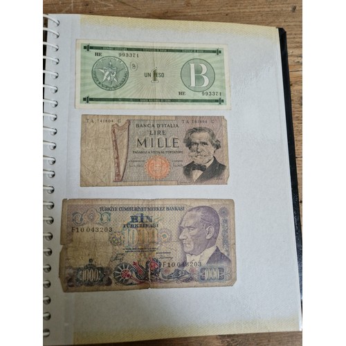 243 - Three folders of assorted world banknotes