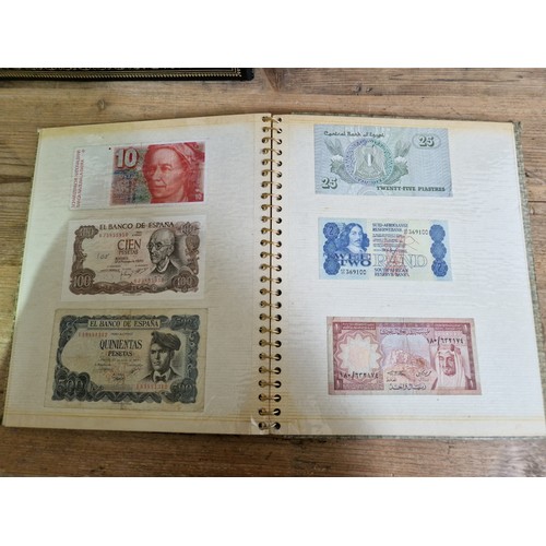 243 - Three folders of assorted world banknotes