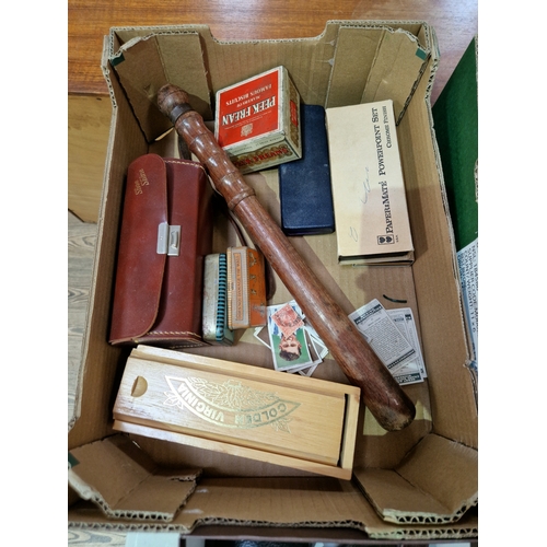 243 - A box of collectables including pens and a truncheon etc.