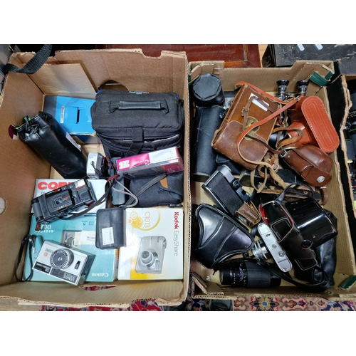 253 - Two boxes of cameras and accessories to include a vintage Vest Pocket Kodak model B folding camera, ... 