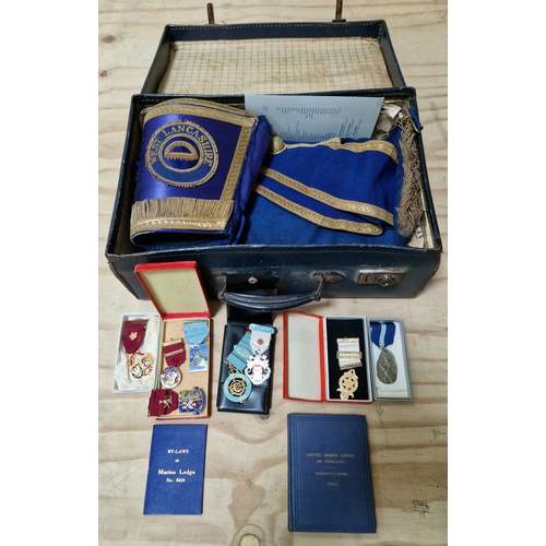 330 - A case of Masonic regalia including three hallmarked silver medals.