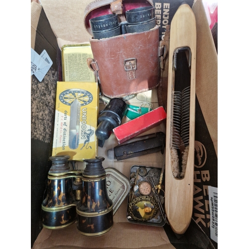 337 - A box of collectables including two pairs of vintage binoculars, a vintage flying shuttle, darts, ci... 