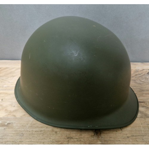 369 - A US military helmet.