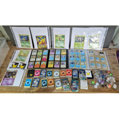 372 - A box of Pokemon cards and accessories to include over 500 cards in 3 binders, one binder containing... 