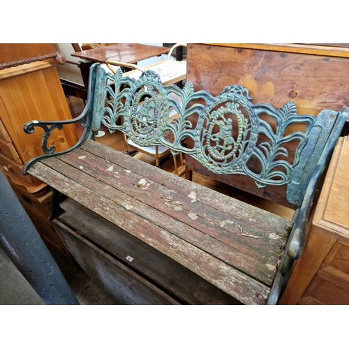 930 - A cast iron garden bench.