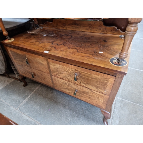 932 - A 1930s Art Deco walnut dressing table.