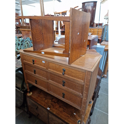 933 - An early 20th century light oak chest of drawers together with an Edwardian oak two tier occasional ... 