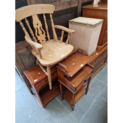 935 - Four pieces of furniture; a beech carver chair, a yew wood side cabinet, a Lloyd Loom linen basket a... 