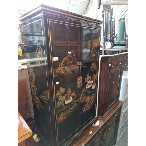 937 - A Chinese black lacquer and gilt decorated side cabinet.