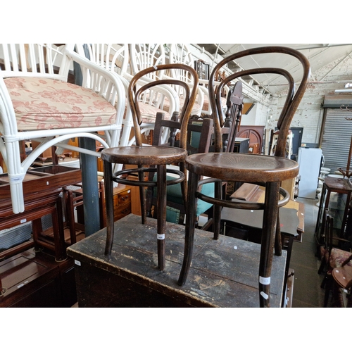 944 - A pair of vintage bentwood cafe chairs.