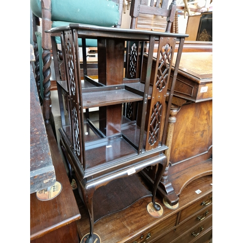 945 - An Edwardian mahogany revolving bookcase.