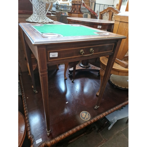 957 - An Edwardian inlaid mahogany card table.