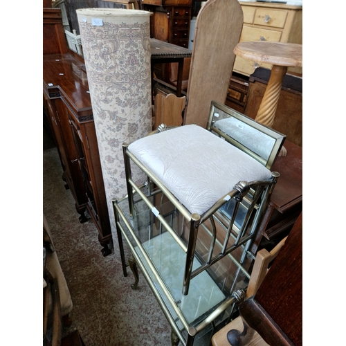 964 - A metal and glass dressing table and stool together with a brass and onyx coffee table and a rug.